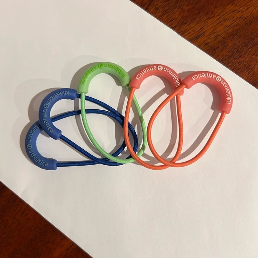 Lululemon zipper pull/hair ties.